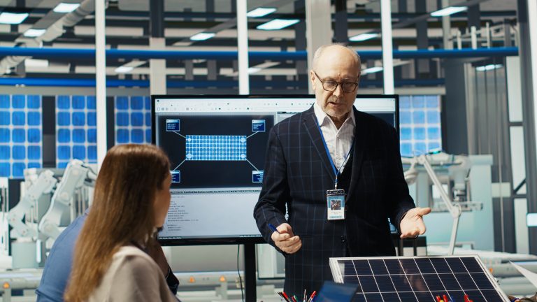 Businessmen in photovoltaics factory doing financial investments Image description